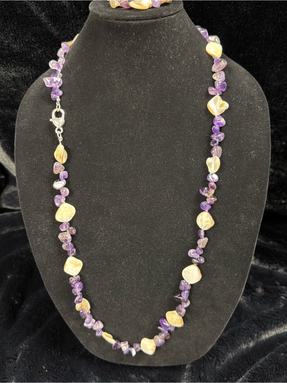 Handcrafted Amethyst and Shell Beaded Womenโs Necklace and matching bracelet.